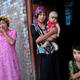 An ethnic Uighur woman hugs her son in Kashgar, Xinjiang Uighur Autonomous Region.